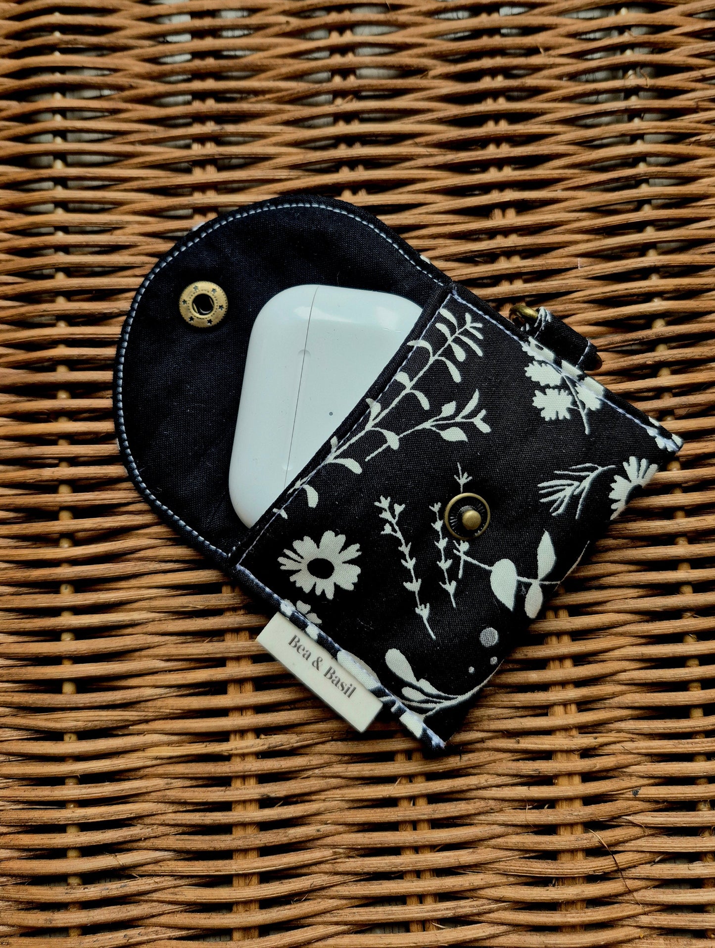 Fauna Cream on Black AirPods Case